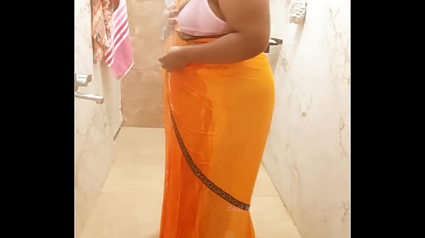 Indian maid bathing in saree
