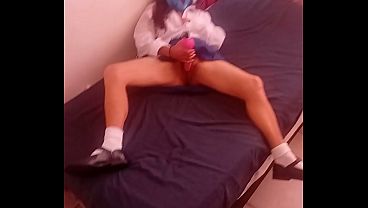 Hot 19 year teen school girl in uniform plays with her self on the bed with pink vibrator,