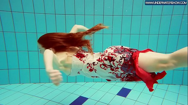 Hot Polish redhead swimming in the pool