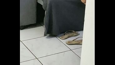 Stepfather films his hot stepdaughter with a white butt alone and without panties in the living room watching TV and using her cell phone. She thought she was alone at home and her half-sister was lying on the bed.