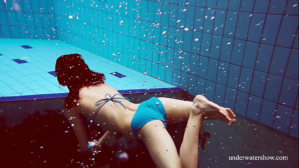 Cute teen Martina swimming naked in the pool