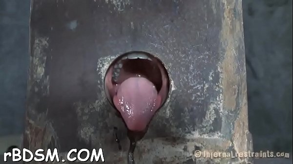Clamped up sweetheart gets a hook in her anal w...