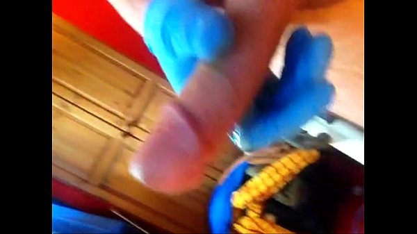 Download Video - Rubber glove fucks huge cock and cums