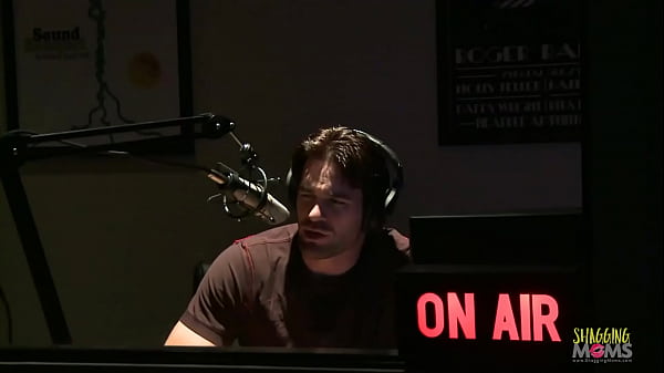 MILF in pink lingerie fucks with a tattooed dude in the studio