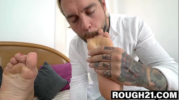 Beautiful blonde Cherry Kiss is enjoying sucking her own toes on her bed when Dean comes to have a piece of the action.