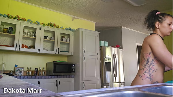 Girlfriend Tidying Up The Kitchen
