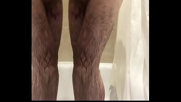 Hairy man strips and showers (mirror effect)
