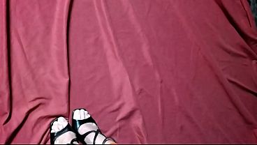 A girl tied up with red duct tape and gagging during a photo shoot