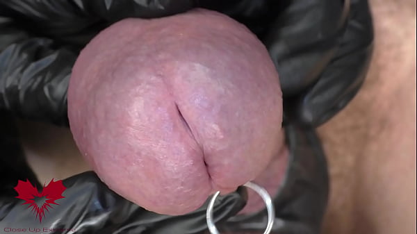 This is Close Up Extreme. Main frontal view. Latex gloves, detailled peehole and cumshot.