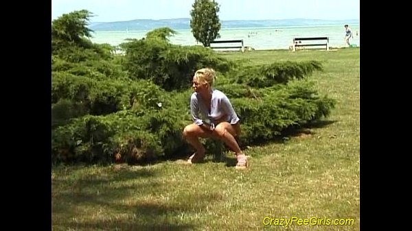 Crazy pee girl on the beach