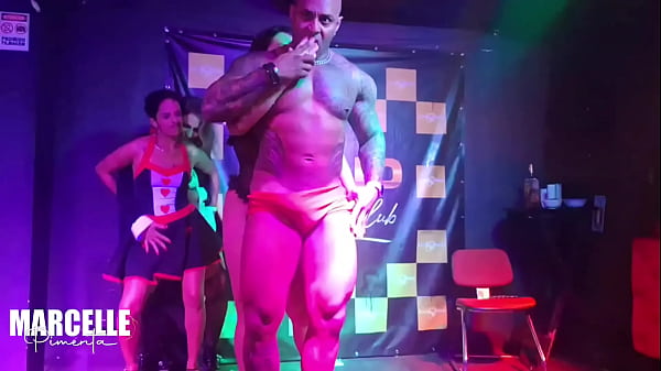 Group of girls having sex with stripper on nightclub stage