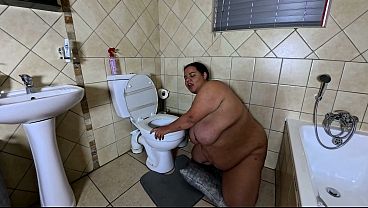 Playing with my fat pussy while licking the toilet