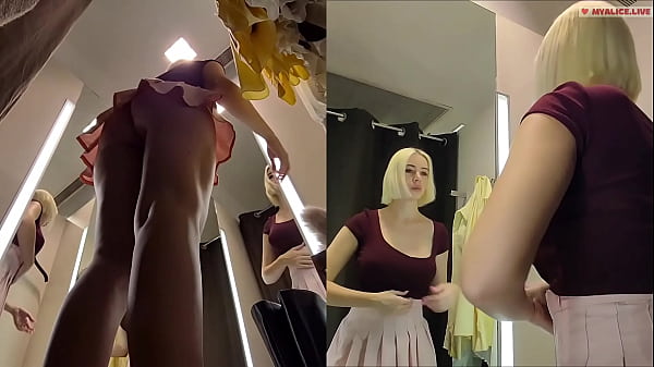 Hidden camera in fitting room. Upskirt view on pussy and big tits