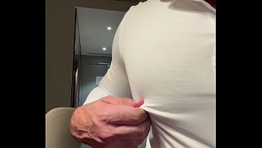 Business guy flexes and jerks off