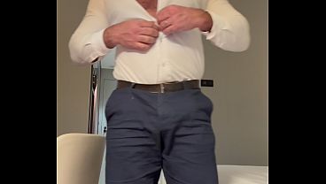 Business guy flexes and jerks off
