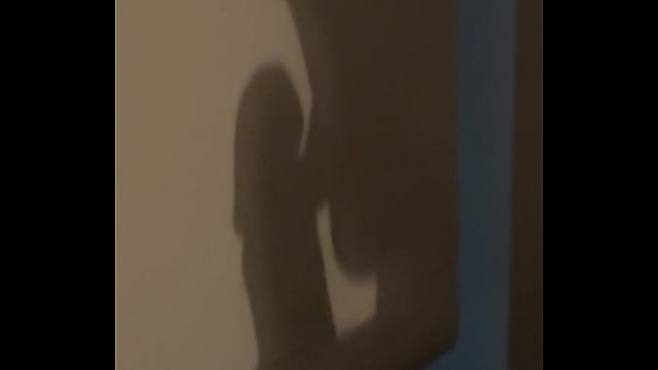 The shadow reflects her sucking his cock