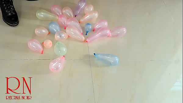 Small balloons pop with high heels boots. FULL