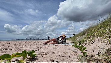 Milf flashing hairy pussy on public beach
