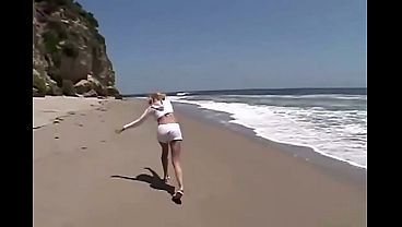 Petite teen lesbian Little Summer fingered on the beach
