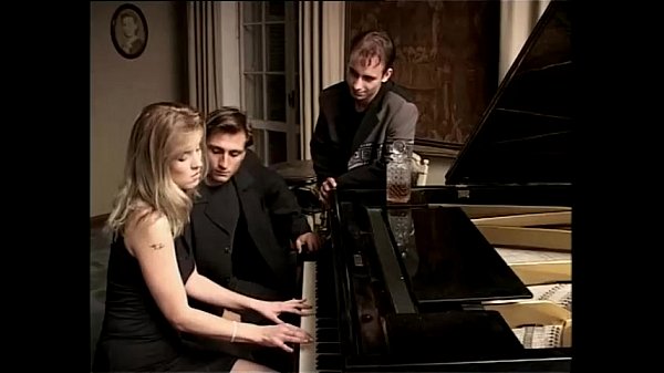 Download Video - Blonde whore playing piano and two cocks