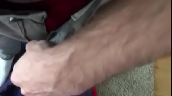 Guy wetting his grey jeans