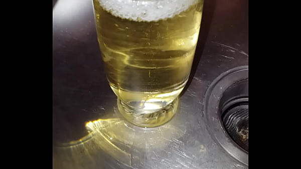 Plenty of strong yellow piss into a glass
