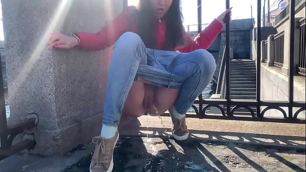 Girl pee in a public place