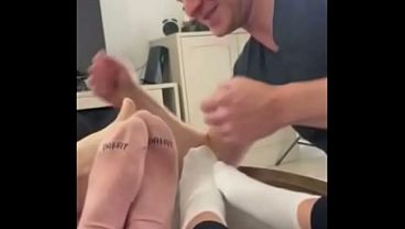 Kirstin, Luna, and Giggi are having fun with their foot slave.