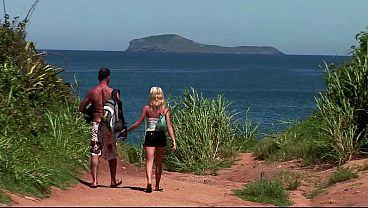 They take a beautiful blonde to the beach to fuck her with a double penetration