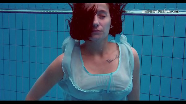 Hot teen unterwasser swims and strips