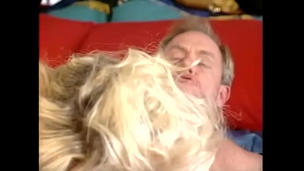 Busty babe in white stockings J.R. Carrington sucks a cock in her bedroom