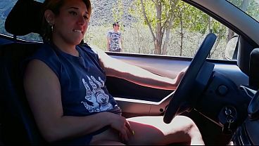 Blonde gives a blowjob to a stranger in the park parking lot