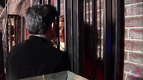 A guy fucks two of the slaves that he keeps in his BDSM mansion