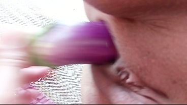 She sucked on his large penis while he inserted an eggplant into her vagina.
