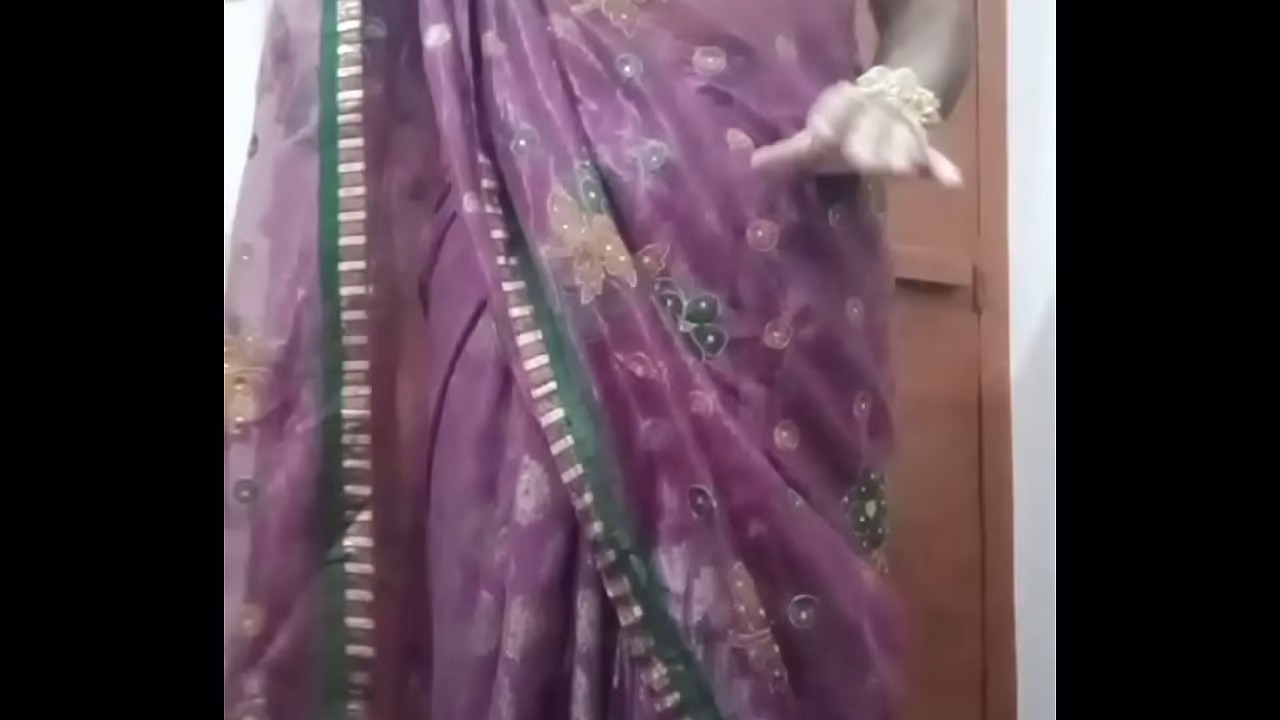 Indian Gay Crossdresser Bottom Gaurisissy pressing and playing with her big boobs in purple saree with heavy jwellery