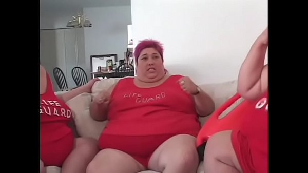 Fat bellied chick in red uniform Zazie Jeanette rides one long stick