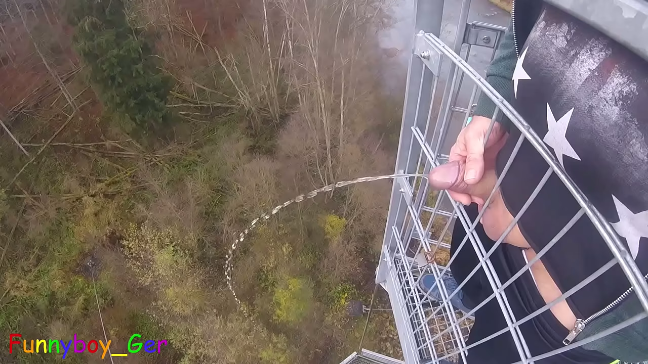 I pee outside from a very public observation tower and then masturbate my penis, and my balls are fat. But then people came along...