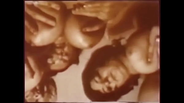 Three horny girlfriends suck big tits and caress each other on cam for a 60s porn movie