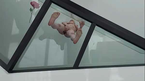 Perverted woman squirting on top of a glass floor