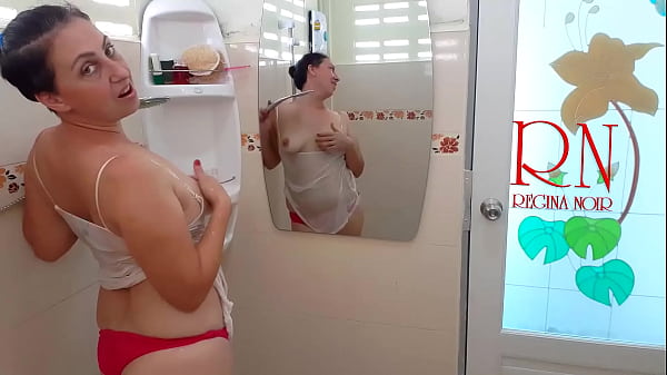 The girl bathes in a shower in a T-shirt and in shorts. Shower naked show FULL