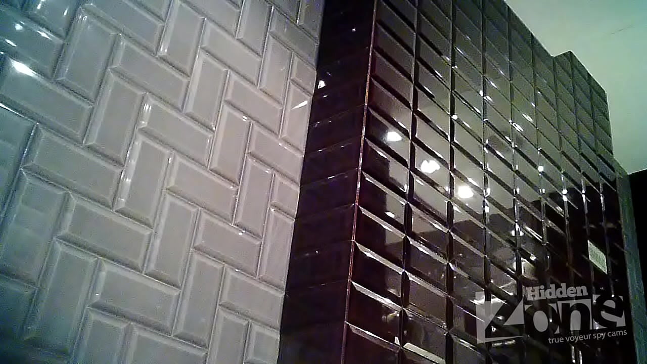 Cute girl washing in the sink in a toilet.