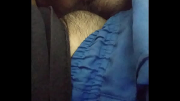 Playing with this hairy male's cock.