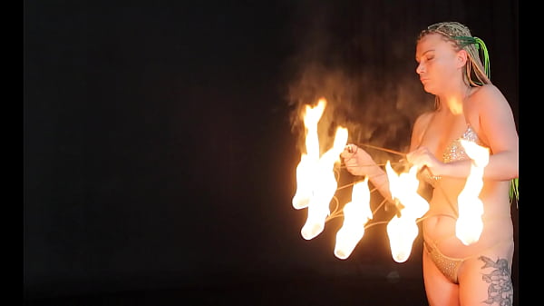 Busty MILF juggles fire.