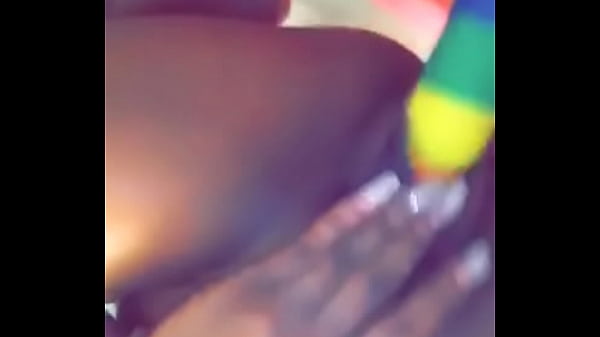 Ebony babe sits on fake dick