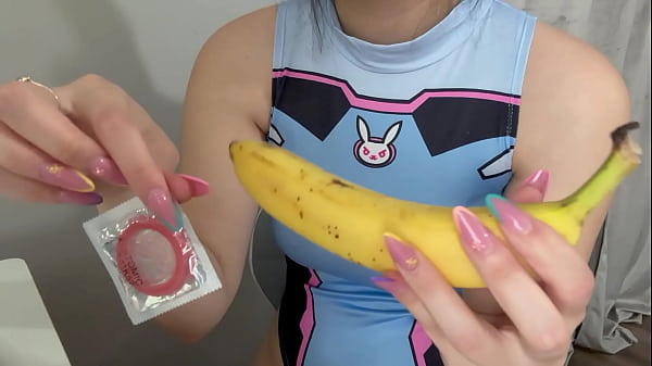 My stepsister puts a condom on the banana, plays with it, then sticks it in a fake pussy babe