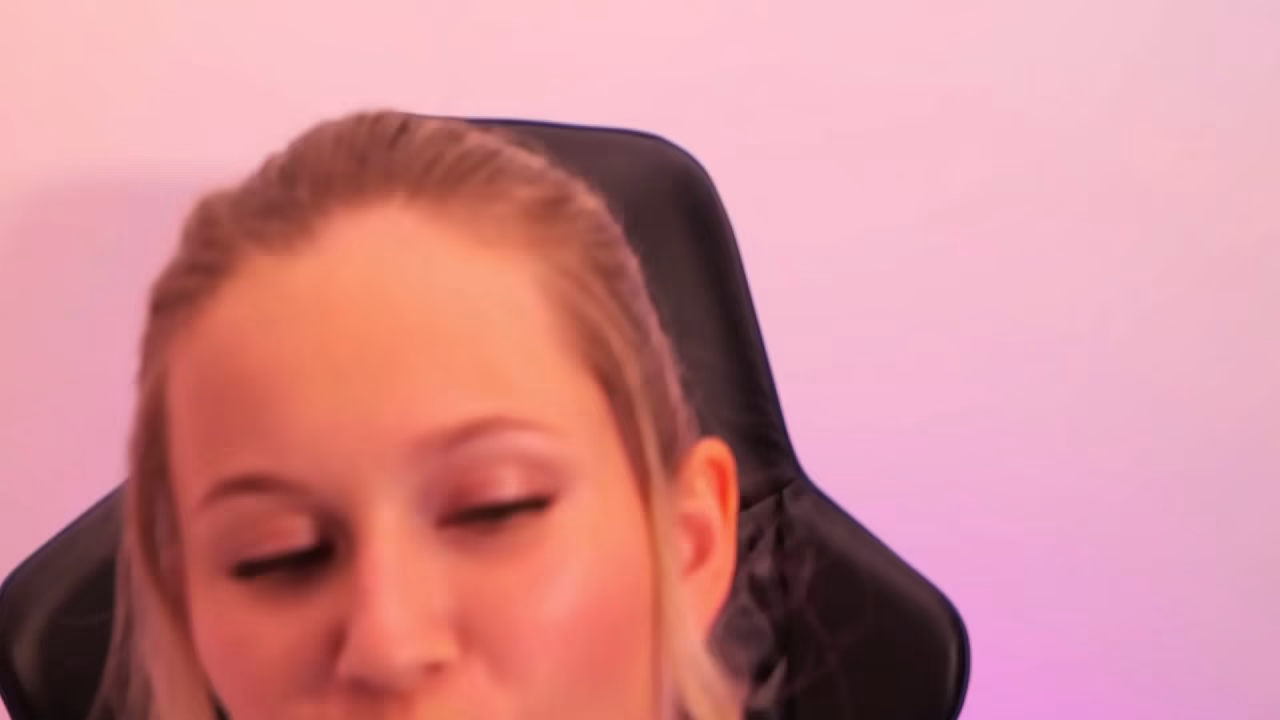 A beauty with red lipstick sucks her finger