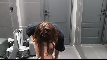 After the gym, in the shower: a brunette with small breasts sucks and gives herself doggy style.