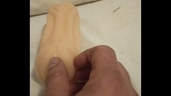 Playing with artificial pussy