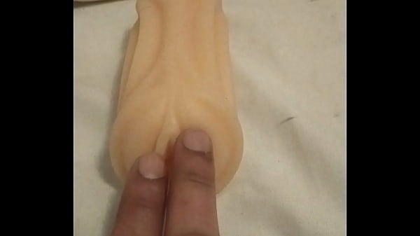 Playing with artificial pussy