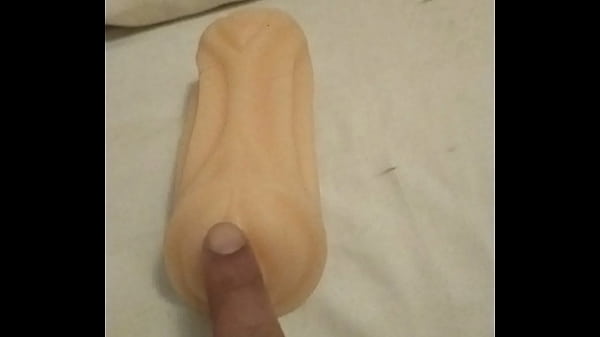Playing with artificial pussy